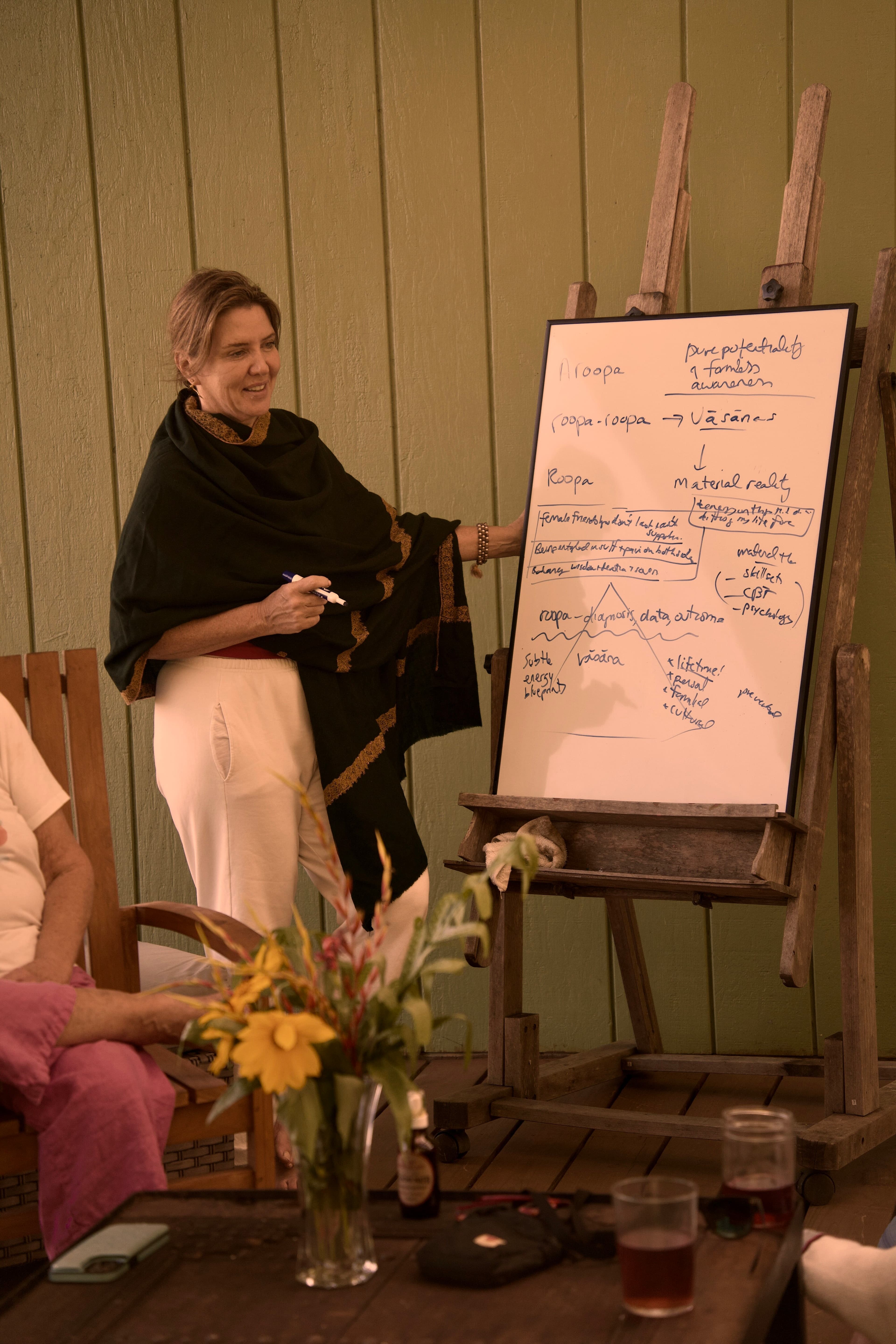 Christine teaching, wrapped in a shawl